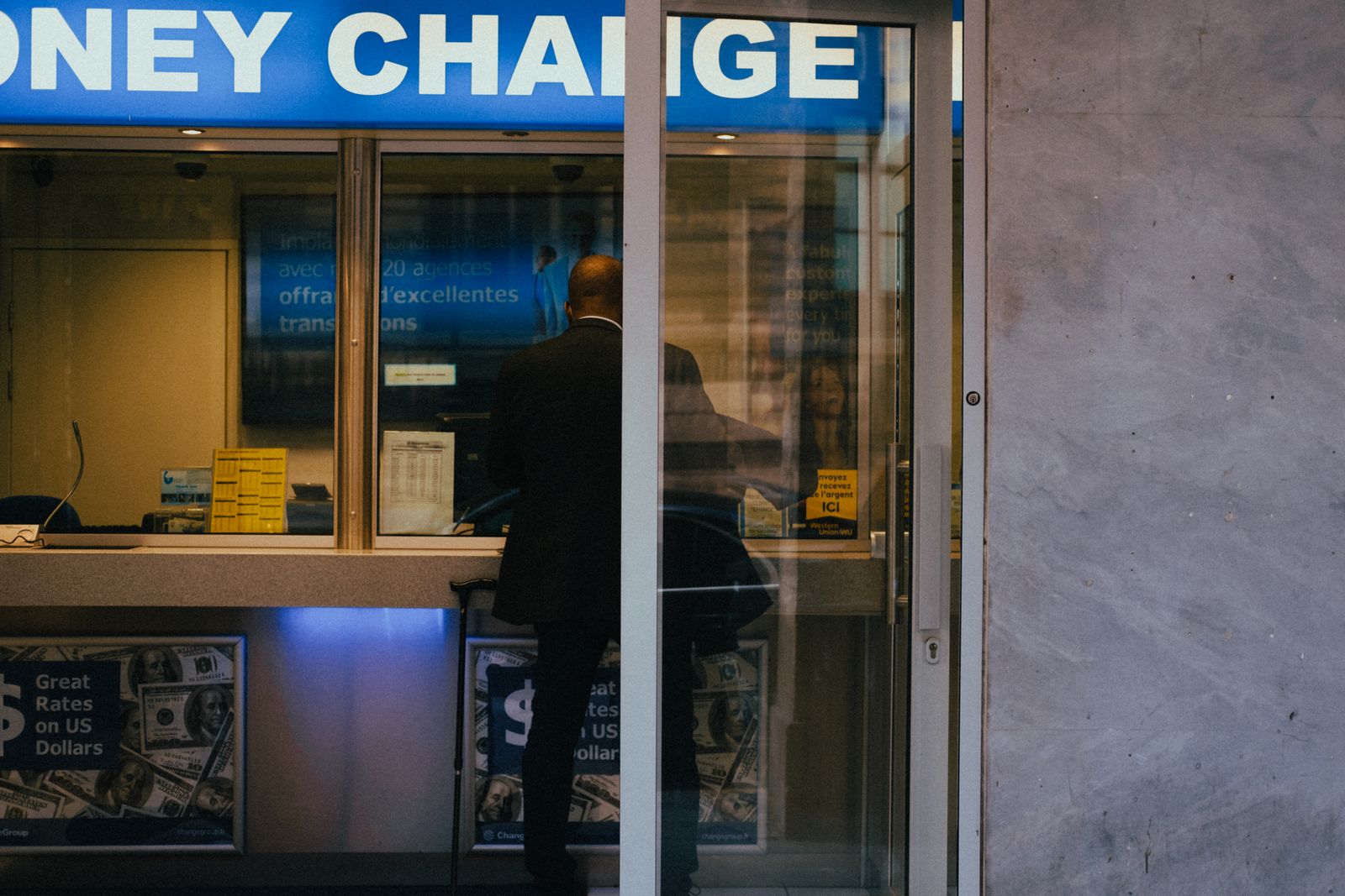 Family collecting cash at a money-change agent, sent by a relative abroad